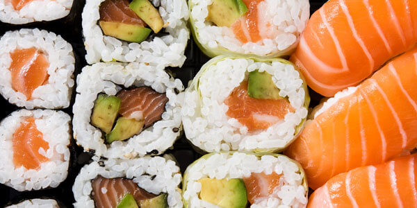 Maki And Nigiri Sushi Set On Black Background. Close Up